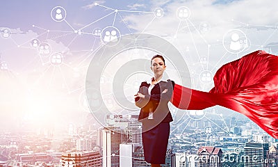 Concept of power and sucess with businesswoman superhero in big city Stock Photo