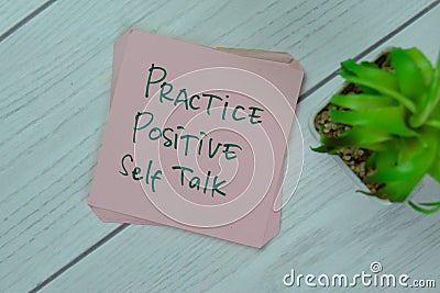 Concept of Practice Positive Self Talk write on sticky notes isolated on Wooden Table Stock Photo