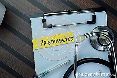 Concept of Prediabetes write on sticky notes with stethoscope isolated on Wooden Table Stock Photo