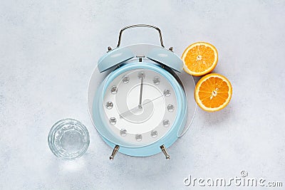 Concept of proper portioned nutrition for health calculated by the clock. Group useful breakfast coffee, tea, fruits, oats, nuts, Stock Photo