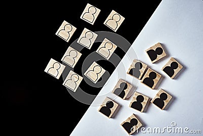 Concept of racism and misunderstanding between people, prejudice and discrimination. Wooden block with a white people figures and Stock Photo