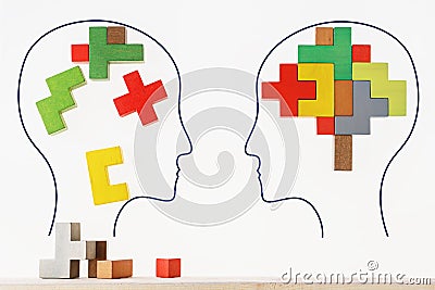 The concept of rational and irrational thinking of two people. Heads of two people with colourful shapes of abstract brain for con Stock Photo