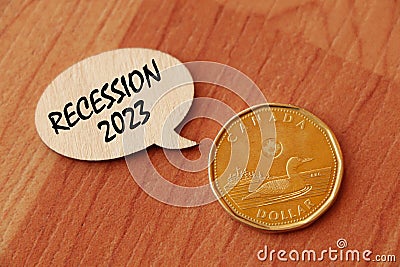 Concept of Recession 2023 write on wooden sign isolated on Wooden Table. Editorial Stock Photo