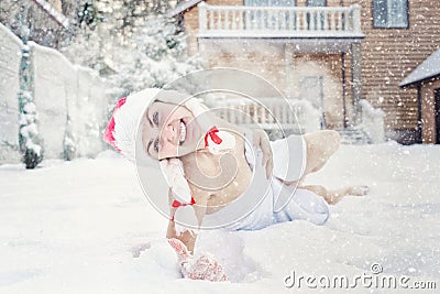 A beautiful woman refresh in snow after hot sauna.Concept of: relax, vacation,healthy lifestyle. Stock Photo