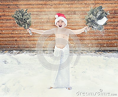 Boy refresh in snow after hot sauna.Concept of: relax, vacation,healthy lifestyle. Stock Photo