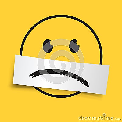 Concept of melancholy with an emoticon usually expressing joy, made sad by an inverted smile. Stock Photo