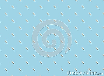 the concept of saving the earth. seamless pattern fluorescent lamps. on blue Stock Photo