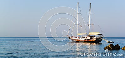 concept of sea voyage, seaside panorama with a ship against a clear blue sky Stock Photo