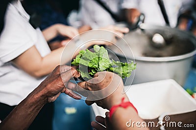 The concept of sharing: Participation in sharing food for the poor Stock Photo