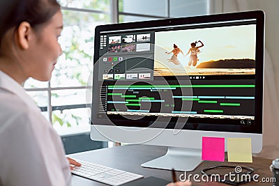 Concept of simple operation of blogger and vlogger, hand using computer on video editor works with footage on wooden table. Stock Photo