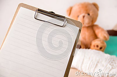 The concept of social assistance to children. Empty sheet of paper on a background of toys. Copy space. Stock Photo