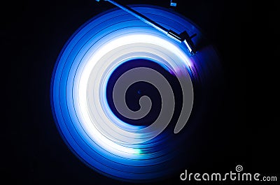 Concept of speed - Trail of fire and smoke - Vinyl record. Burning vinyl disk. Turntable vinyl record player. Retro audio equipmen Stock Photo