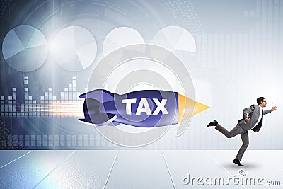 Concept of tax with businessman chased by rocket Stock Photo