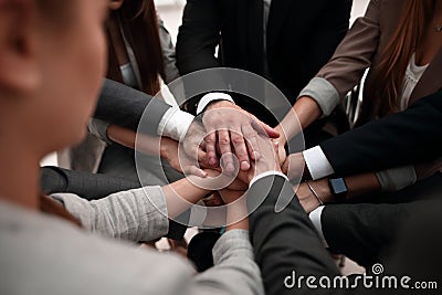 Close-Up of hands business team showing unity with putting their hands together. Stock Photo