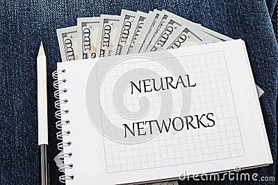 The concept of technology and development. Phrase, words, text NEURAL NETWORKS on a blank sheet of notepad against the Stock Photo