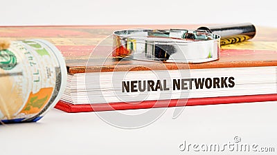 The concept of technology and development. Phrase, words, text NEURAL NETWORKS on the end of the book, front view Stock Photo