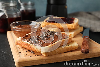 Concept of toasts with choco cream on wooden board Stock Photo