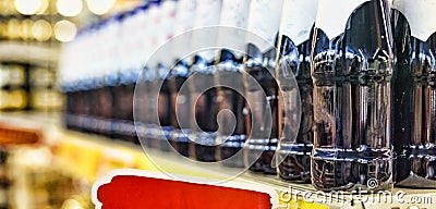 The concept: trade in a supermarket, the action, sale. Closeup: beer, wine or drinks without alcohol on the shelves of the superma Stock Photo