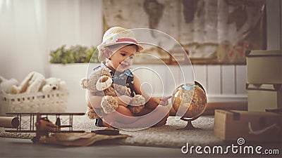 Concept travel. child girl at home dreaming of travel and tourism Stock Photo