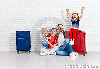 Concept travel and tourism. happy family with suitcases near w Stock Photo