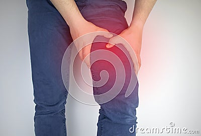 A man suffers from hip pain. The concept of treating a hip joint for trauma, plantation or osteoarthritis Stock Photo