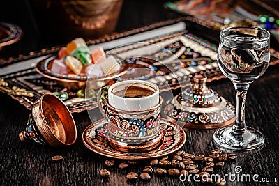 The concept of Turkish cuisine. Turkish brewed black coffee. Beautiful coffee serving in the restaurant. Background image Stock Photo