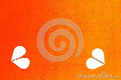 Concept - two broken hearts, divorce - on orange background Stock Photo