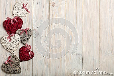 Concept Of Valentine's Day. Wicker hearts on wooden background w Stock Photo