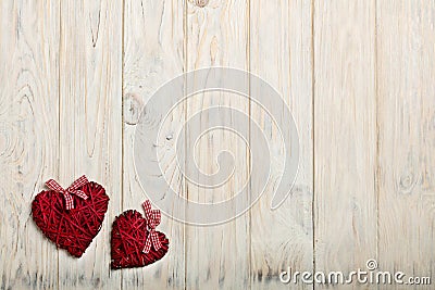 Concept Of Valentine's Day. Wicker hearts on wooden background w Stock Photo