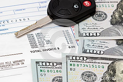 Car key, vehicle warranty repair bill and 100 dollar bills cash Stock Photo