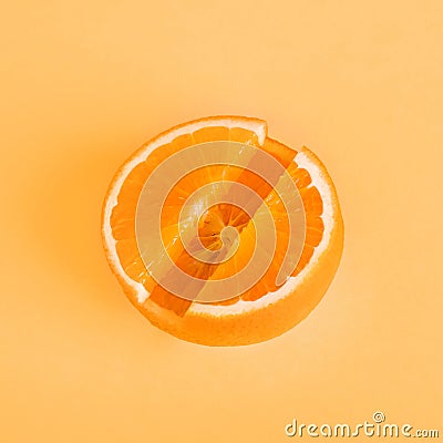 Concept Vitamin C. Fresh orange in pill form Orange background. Stock Photo