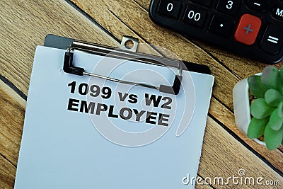 Concept of 1099 vs w2 Employee write on paperwork isolated on Wooden Table Stock Photo