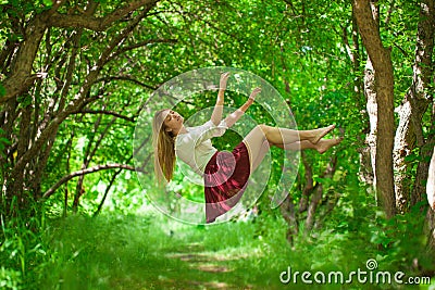 The concept of weightlessness. Woman flies. Beautiful girl hovers in the air Stock Photo