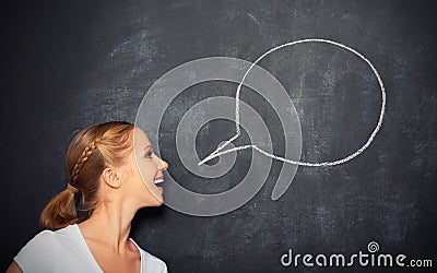 Concept woman said at a blank blackboard Stock Photo