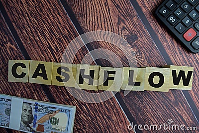 Concept of The wooden Cubes with the word Cashflow on wooden background Stock Photo