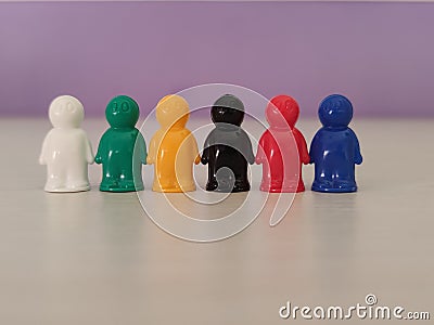Conception - partnership, cooperation, game figures or pawns in a business situation. Stock Photo