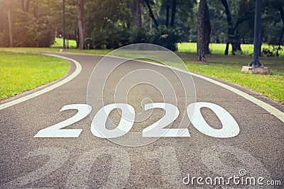 Concepts of goals for success, text 2020 written on the curve of road in the park. Stock Photo