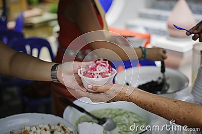 Concepts of poverty in Asian society : Volunteers Share Food to the Poor to Relieve Hunger Stock Photo