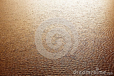 Conceptual abstract background on lake, water waves at sunset. Stock Photo