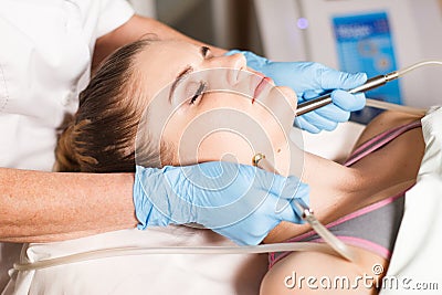 Conceptual beauty and cosmetology image of the hands of several beauticians holding their respective equipment. Beauty Stock Photo