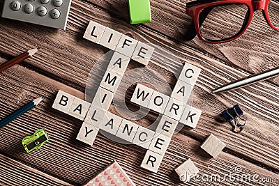 Conceptual business keywords on table with elements of game making crossword Stock Photo