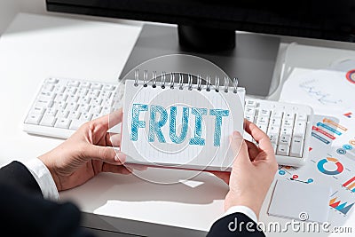 Hand writing sign Fruit. Concept meaning seedbearing in flowering plants formed the ovary after flowering Stock Photo