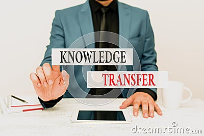 Conceptual caption Knowledge Transfer. Word for sharing or disseminating of knowledge and experience Presenting Stock Photo