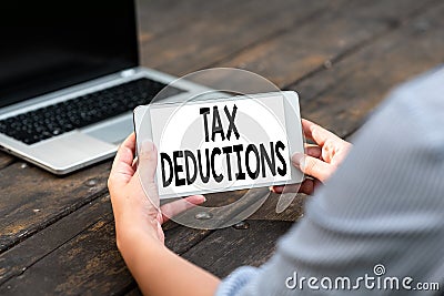 Conceptual caption Tax Deductions. Word Written on an amount or cost that subtracted from someone s is income Voice And Stock Photo