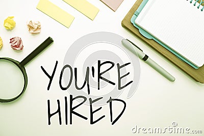 Conceptual caption You Re Hired. Concept meaning New Job Employed Newbie Enlisted Accepted Recruited Flashy School Stock Photo