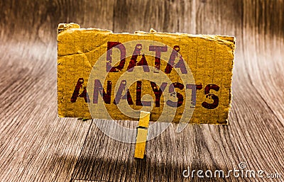 Conceptual hand writing showing Data Analysts. Business photo text Programmer Design and Create Report Identifies patterns Paper n Stock Photo