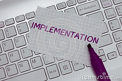 Conceptual hand writing showing Implementation. Business photo text The process of making something active or effective Stock Photo