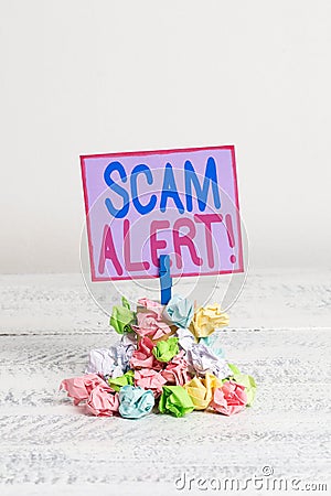 Conceptual hand writing showing Scam Alert. Business photo text fraudulently obtain money from victim by persuading him Stock Photo