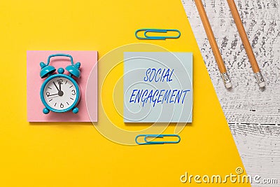 Conceptual hand writing showing Social Engagement. Business photo text Degree of engagement in an online community or Stock Photo