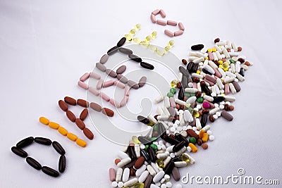 Conceptual Hand writing text caption inspiration Medical care Health concept written with pills drugs capsule word diabetes On whi Stock Photo